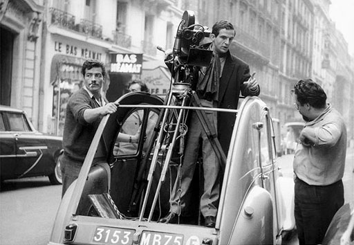 Francois Truffaut on the set of Confidentially Yours: on the set, taking the wheel