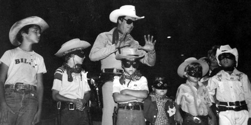 Kids dressed in costume as the masked Lone Ranger
