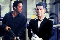Keanu Reeves with a masked Patrick Swayze in Point Break