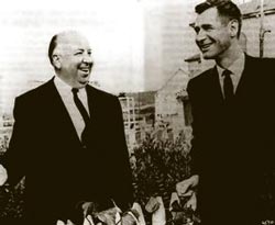 Ed McBain (right) stands with Alfred Hitchcock on the set of The Birds