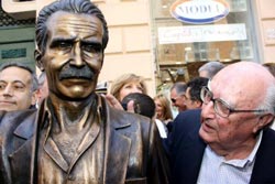 Andrea Camerelli inspects the statue of Inspector Montalbano erected in Camilleri’s hometown, Porto Empedocle, Italy. 
