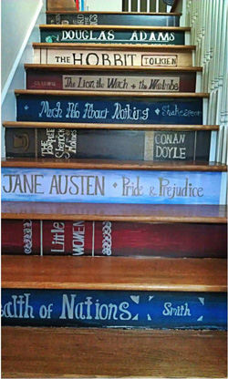 Staircase with risers painted to look like the spines of books