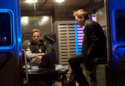 Kevin Bacon and Shawn Ashmore in the back of an ambulance