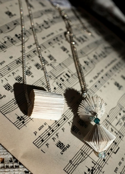 Tiny paper sculpture jewelry by Katie Stainer