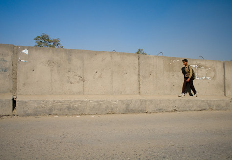 In the Green Zone, concrete blast-walls also serve as raised sidewalks for pedestrians.