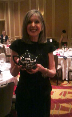 Hank Phillippi Ryan, author of The Wrong Woman, with her Best Contemporary Novel Agatha Award