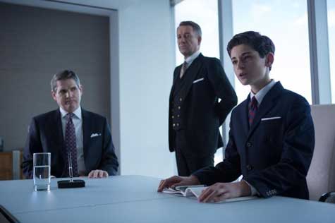 Bruce Wayne (David Mazouz, R) meets with the Wayne Enterprises board members in the "The Blind Fortune Teller" episode of GOTHAM.